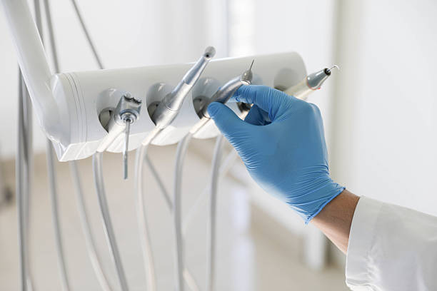 Professional Tooth Extraction technician working in Mount Pleasant, MI